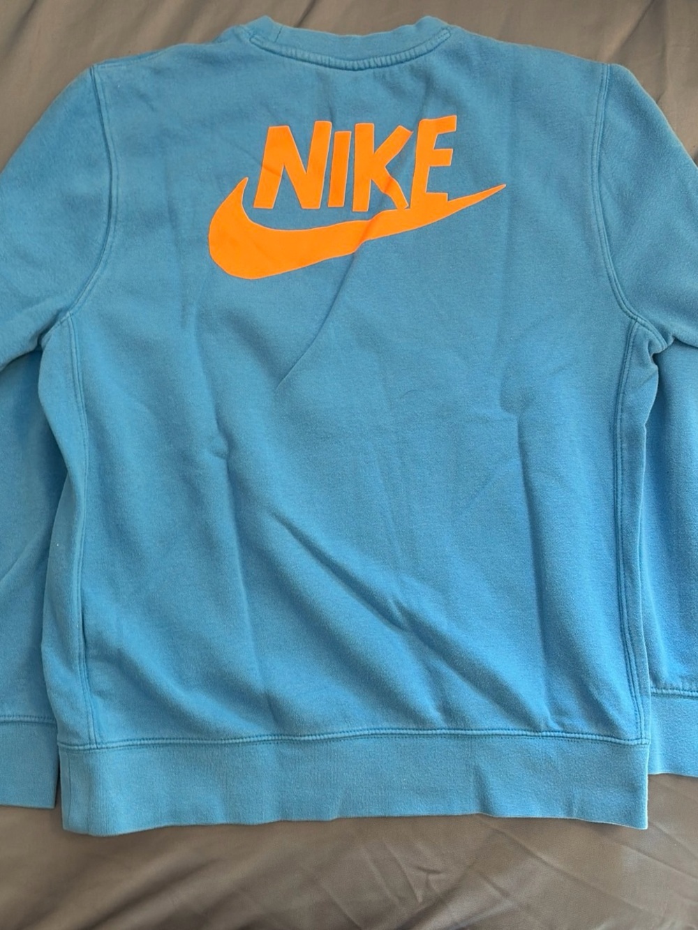 Nike Kids Light Blue Pullover Sweatshirt with Orange Logo